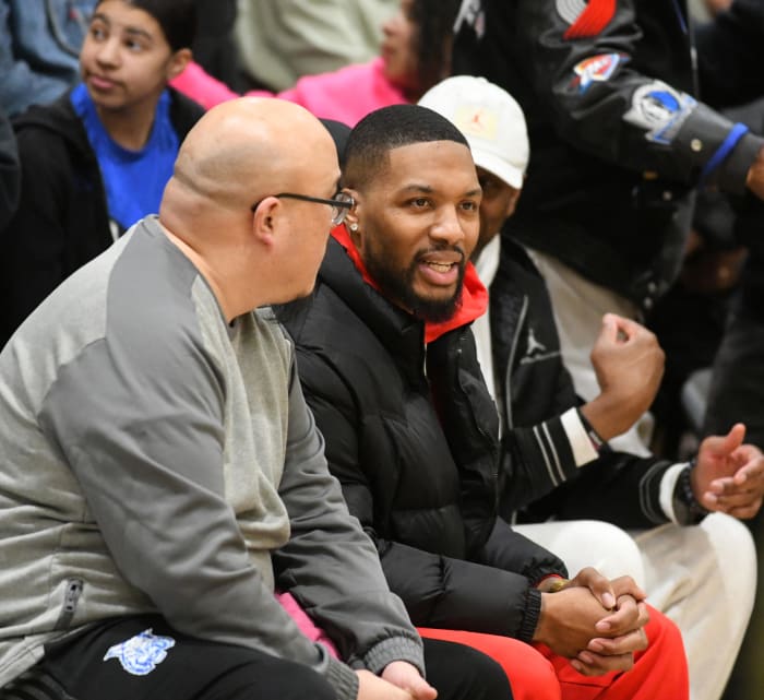 Oakland alum Damian Lillard (middle) was amongst a packed house Tuesday at Oakland Tech, which recorded its fourth win of the season against the Wildcats.